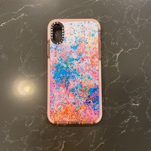 iPhone XS Casetify case by Ingrid Ching with light pink border.